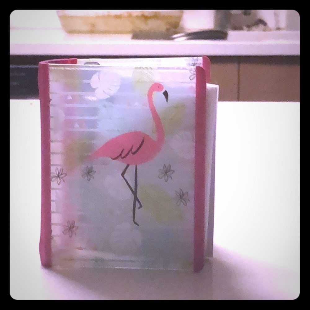 A mini binder that has a flamingo on it